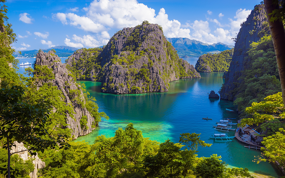 Aerial view of Kayangan Lake with boats in Coron, Philippines.