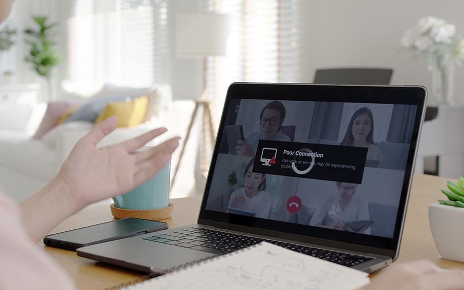 Photo of a laptop with its screen showing a video call with four other people getting disconnected.