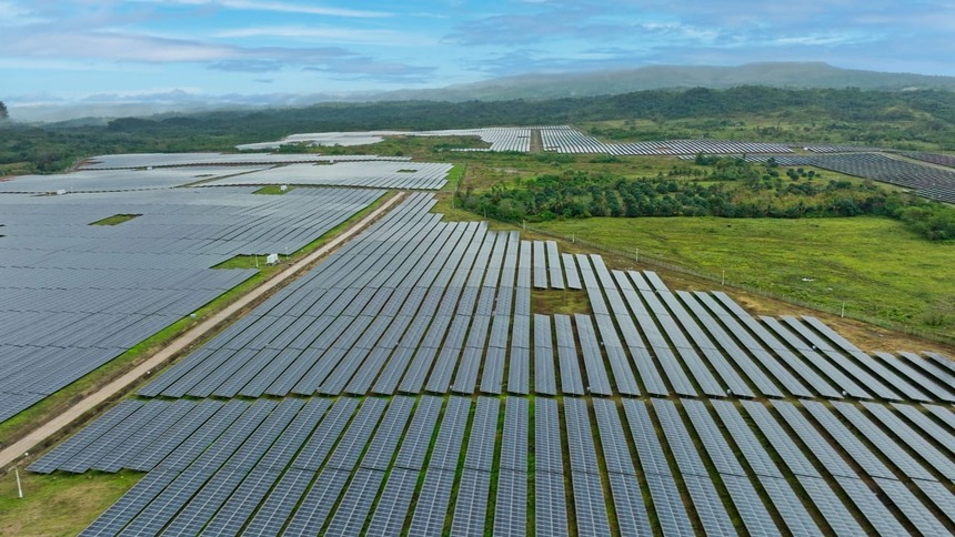 An aerial view of the GigaSol Alaminos solar farm in Laguna, Philippines, showing its vast rows of solar panels.