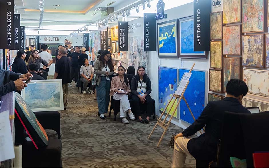 Visitors exploring contemporary artworks and artisan booths at MoCAF.