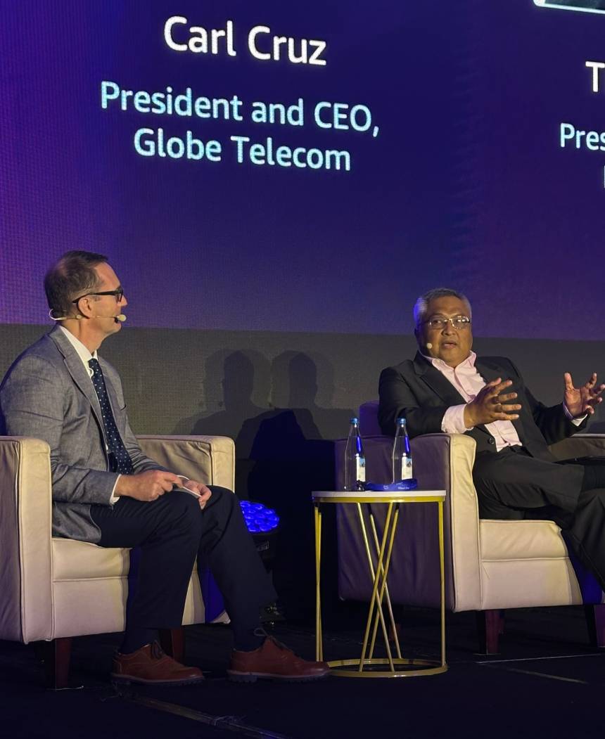Globe President and CEO Carl Cruz speaks during a panel discussion at AWS Cloud Day Philippines 2025.