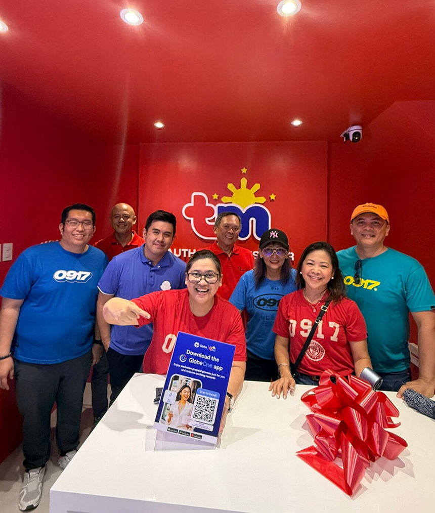 Globe employees posing inside TM Tindahan in Vigan.