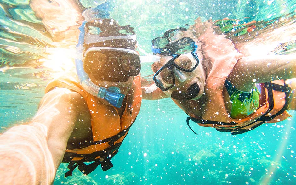 Couple taking a selfie underwater