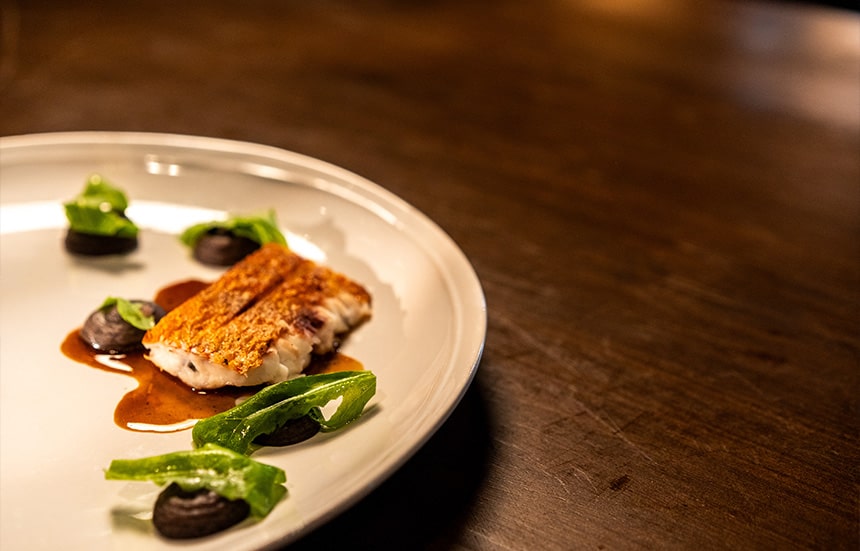 Chef Kevinâs red snapper with black bean and fish tare.