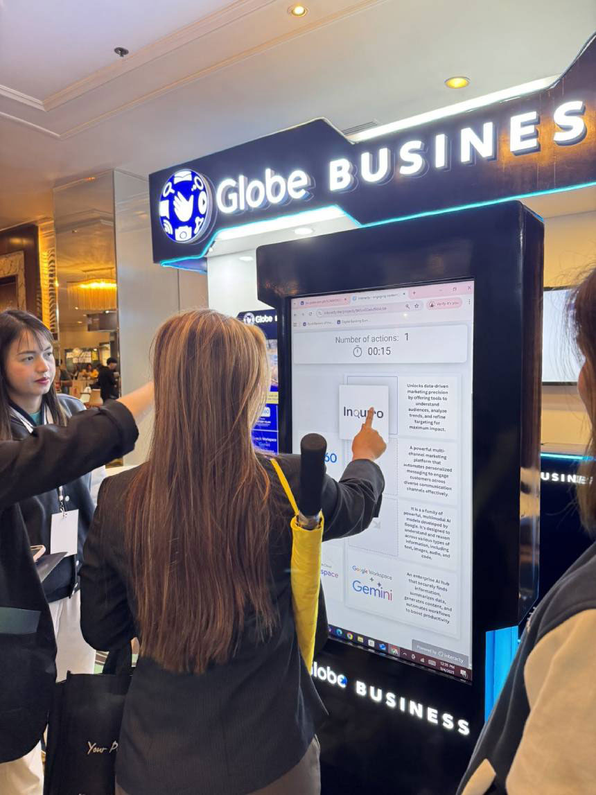 A participant engages with Globe Businessâ interactive âMix & Matchâ booth game.