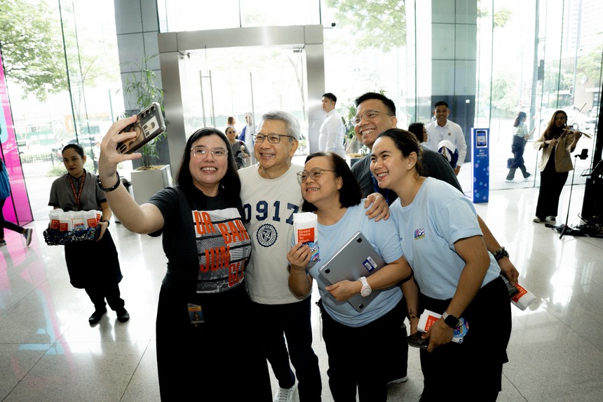 Globe Chief Human Resources Officer Renato Jiao with Globe employees.