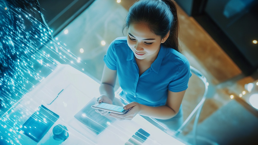 A female worker using her smartphone for work.
