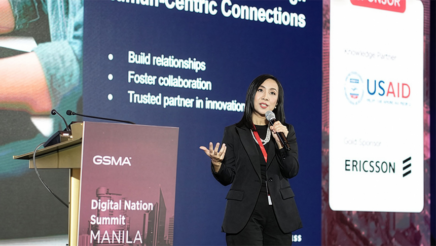 KD Dizon speaks on stage during GSMA's Digital Nation Summit in Manila.
