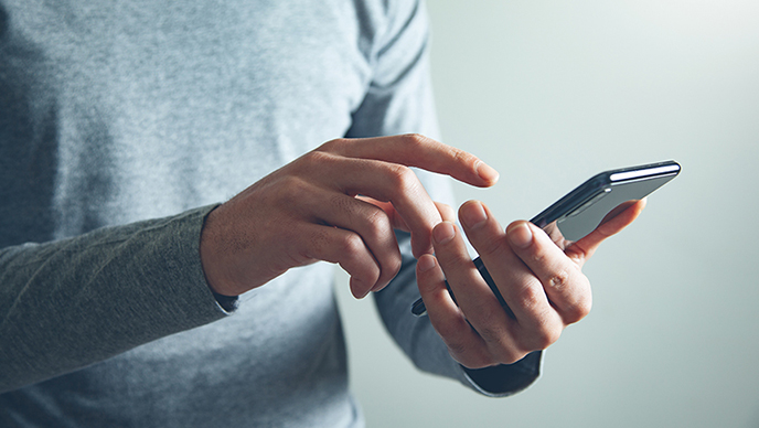 A man using a smartphone.