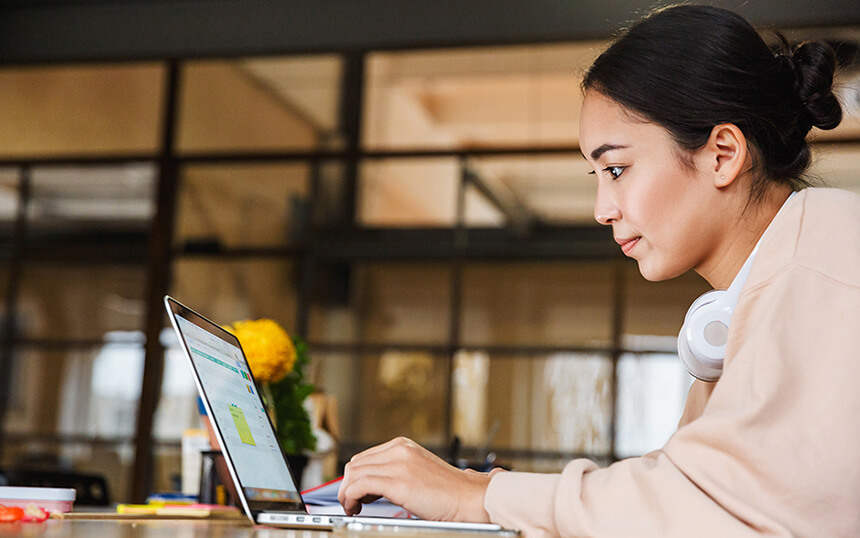 Woman checks her laptopâs privacy controls.