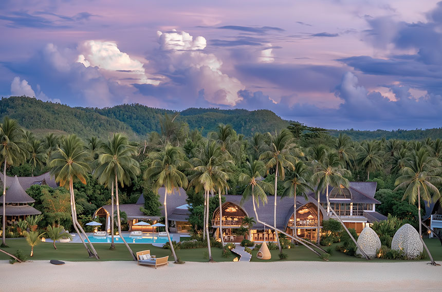 Nay Palad Hideaway aerial view with beach and palm trees.