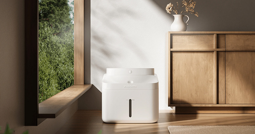 Smart Pet Fountain 2 with a minimalist white design placed indoors near a window.