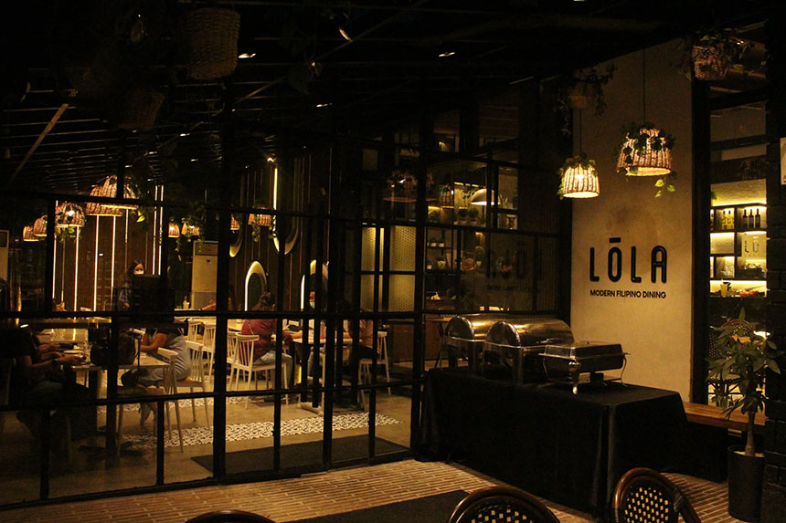 A cozy restaurant interior at night where pet owners can dine nearby with their pets in a relaxed setting.