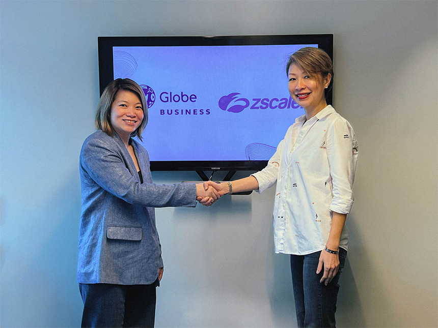 Angeline Po of Globe Business and Jayda Lam of ZScaler shaking hands.