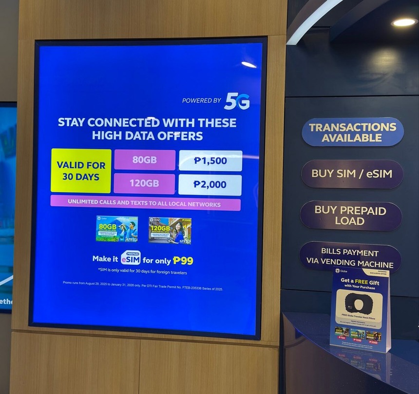 Digital display at the Globe airport store showing 5G data plans for travelers and a list of available services.