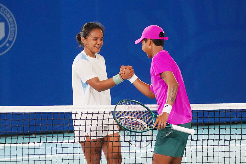 Tenny Madis and Mananchaya Sawangkaew shake hands on the court after their match.