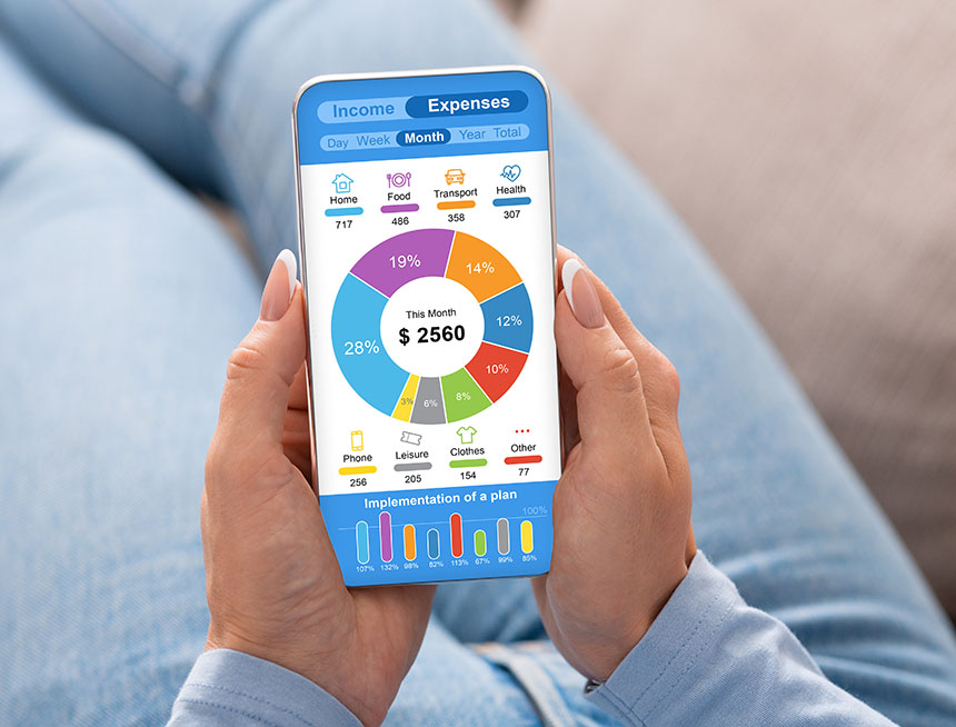A woman checking her monthly expenses on her mobile phone.