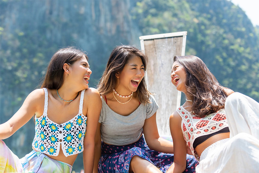 Three female friends on a Galentine tropical vacation.