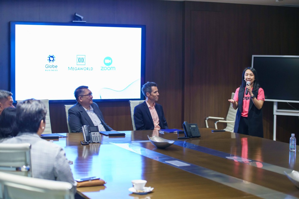 KD Dizon, Head of Globe Business with Megaworld and Zoom executives.