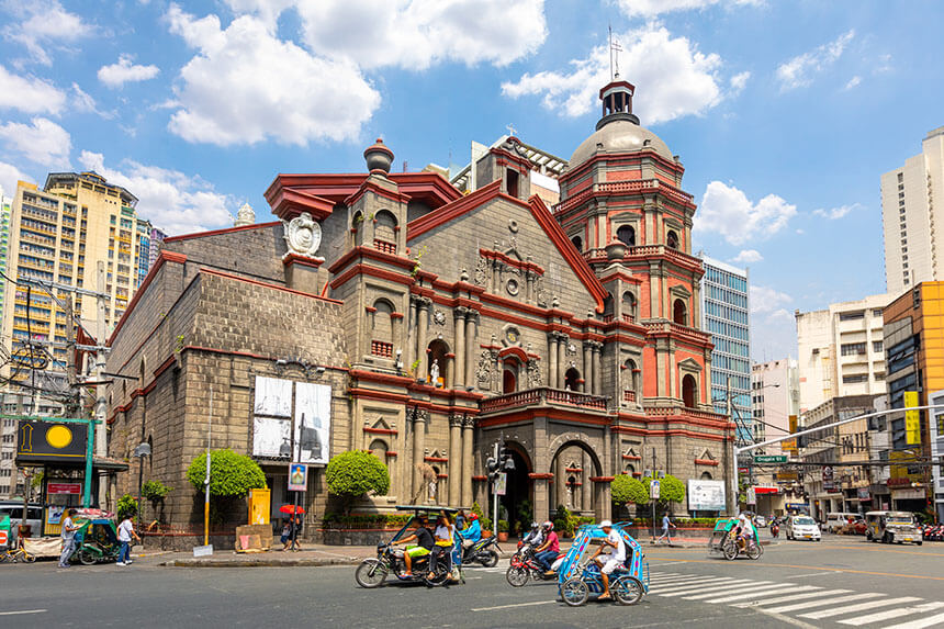 A group of cyclists enjoying a ride in front of the historic Binondo Church.