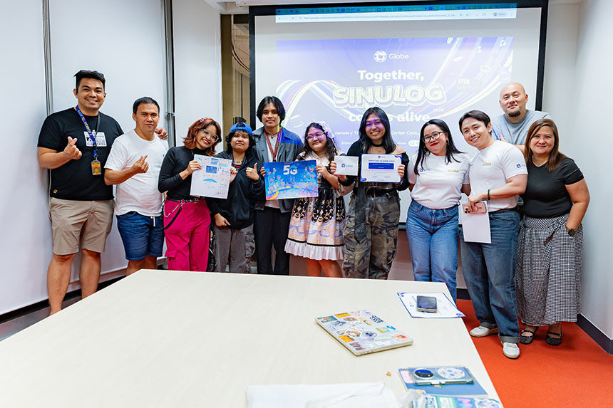 Lorie Mae Urgel and her team holding their certificates, posing together for a celebratory photo.