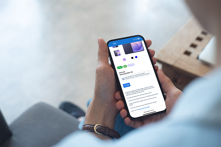 Person with device in hand, ready to interact with the device.