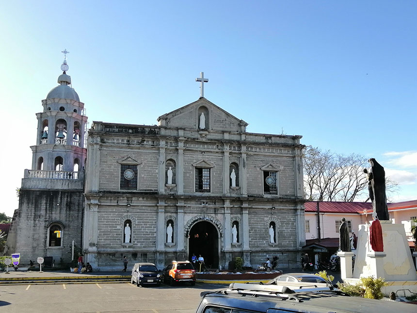 Wide exterior shot of Santa Rosa de Lima Parish Church showcasing its heritage architecture and open church plaza.