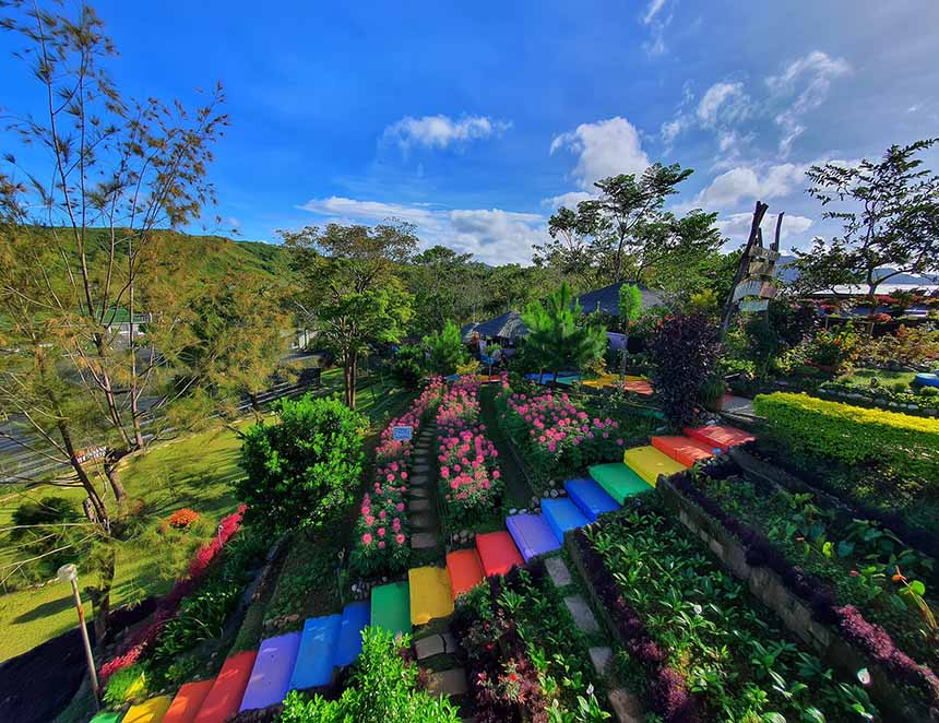 Colorful garden with flowers and mountain views in Aningalan, Antique.