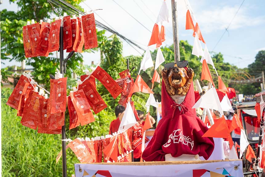 Lechon dressed in costume on parade float during Parada ng Lechon Festival in Batangas.
