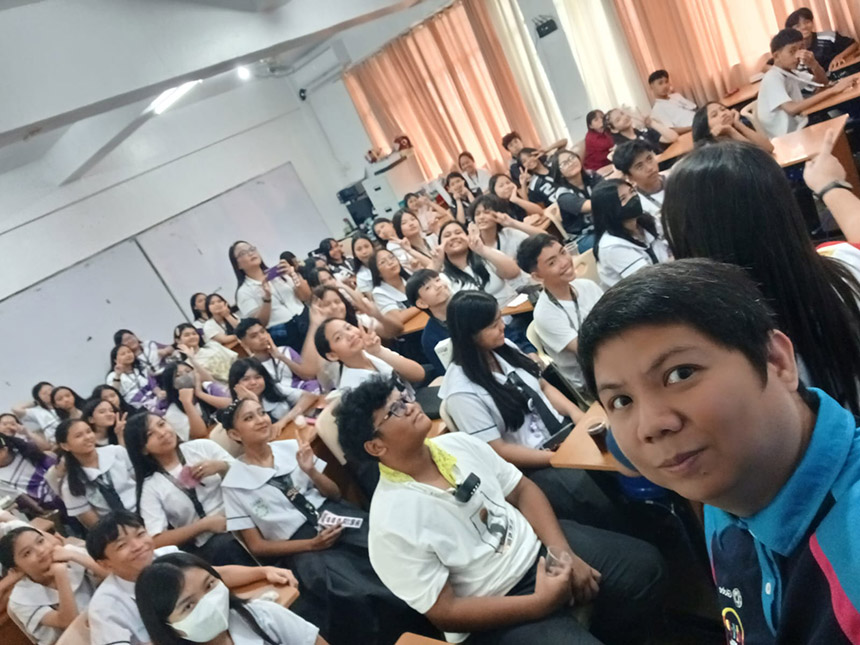 Globe employee volunteer teaches students in the classroom.
