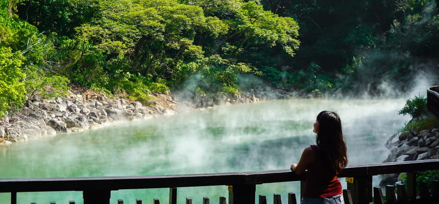 A young woman looks at Beitou Thermal Valley in Taiwan.