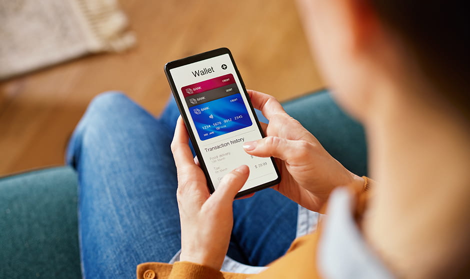 A close-up view of a person using a digital wallet app on their smartphone, showcasing modern, cashless financial transactions and the convenience of managing money digitally.