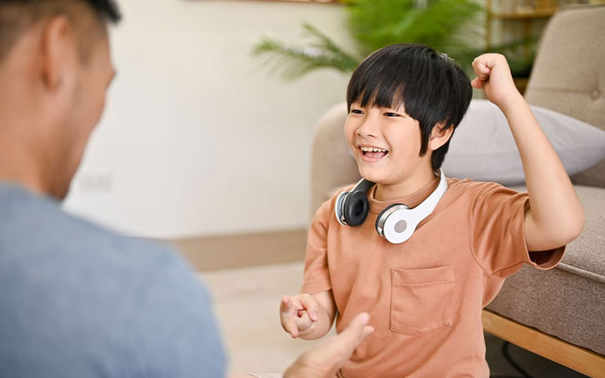A delightful moment showcasing a Pinoy classic game, âJack en Poyâ (rock-paper-scissors), where the young boy's victorious smile lights up as he celebrates his win in this fun-filled match.
