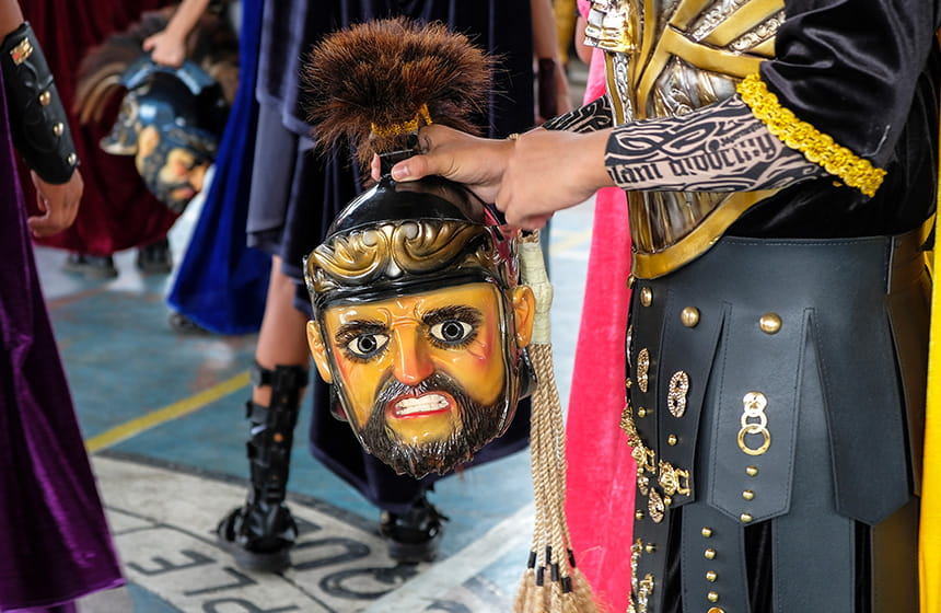 Dinagyang Festival dancers in colorful costumes performing street dance in Iloilo.