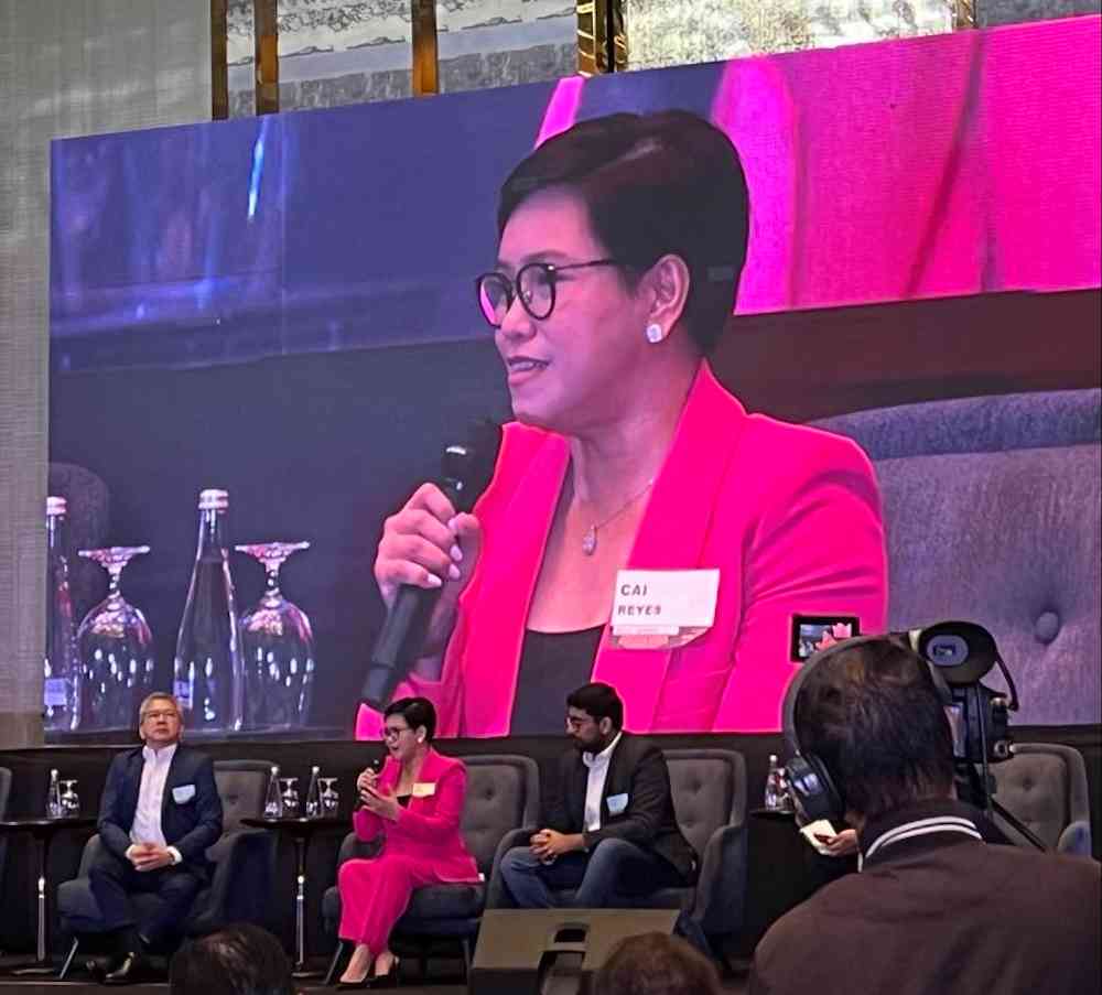 Asticom President and CEO Mharicar Castillo-Reyes, together with Globe Chief HR Officer Ato Jiao and Leena AI Co-Founder and CEO Adit Jain, at the panel discussion.