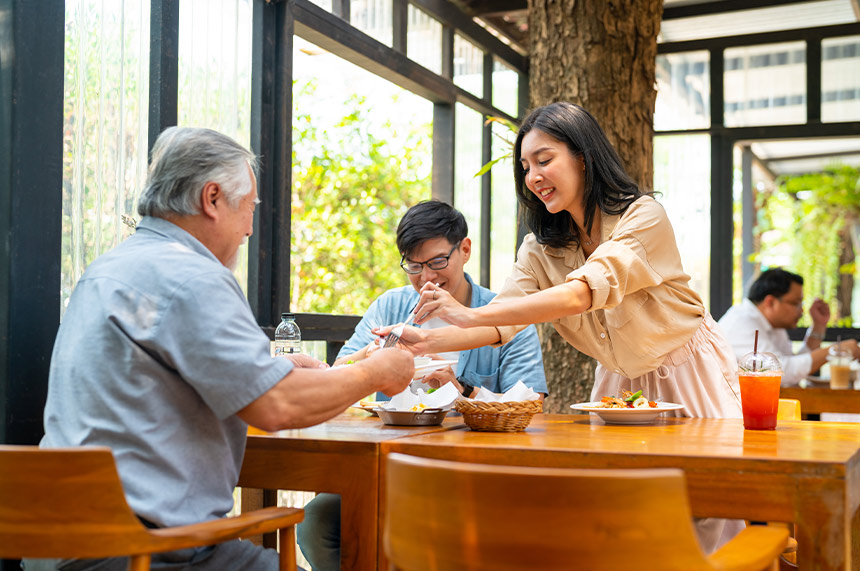 Family enjoying a meal together at a restaurant.