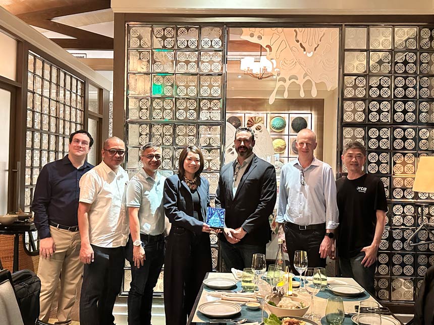 Globe Business and Orca Security leaders stand together holding the 2025 APJ Partner of the Year award.