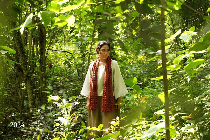 Gregoria de Jesus walks through a forest in a scene from Lakambini: Gregoria de Jesus.