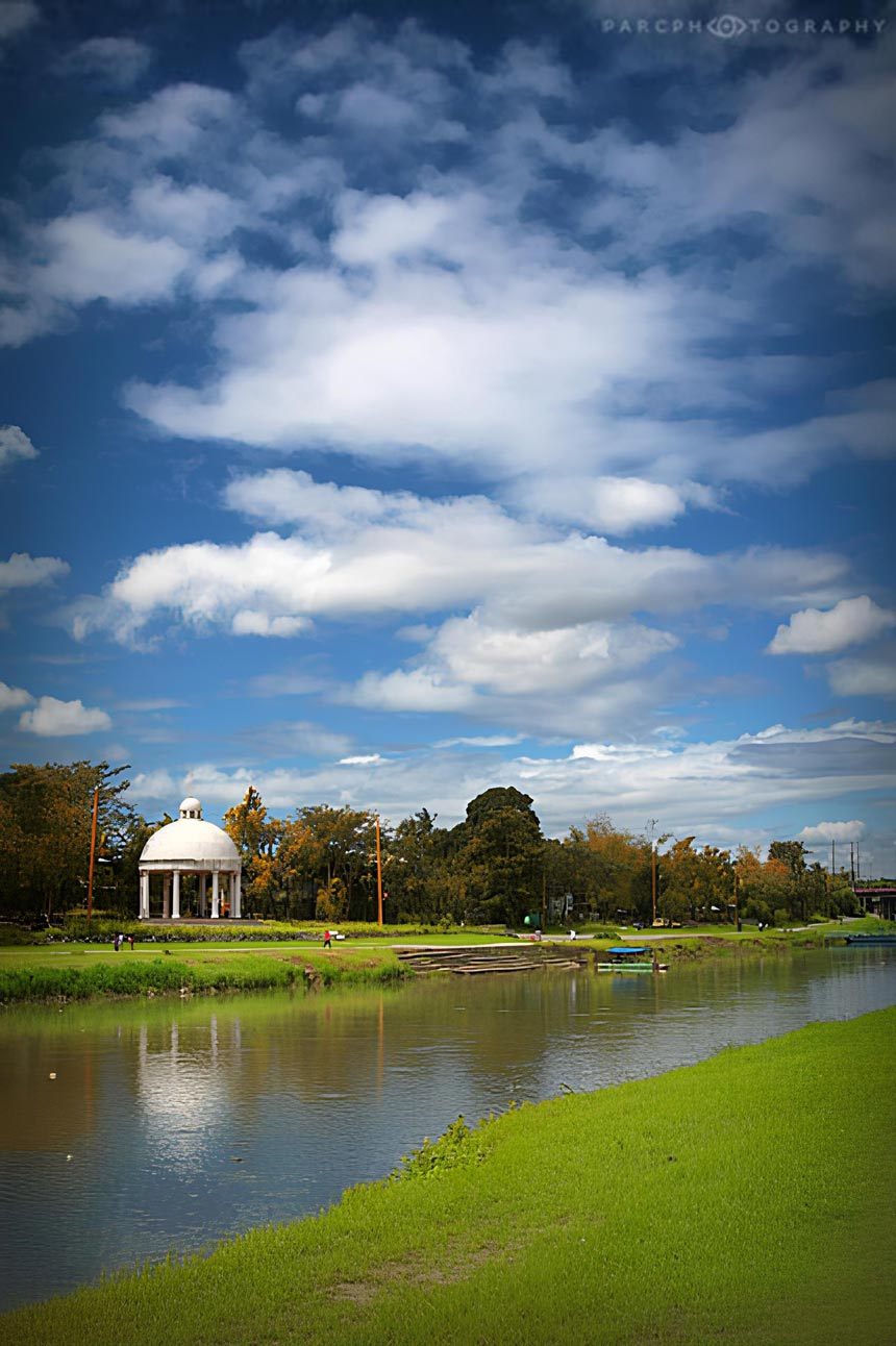 River with a white pavilion in the background.