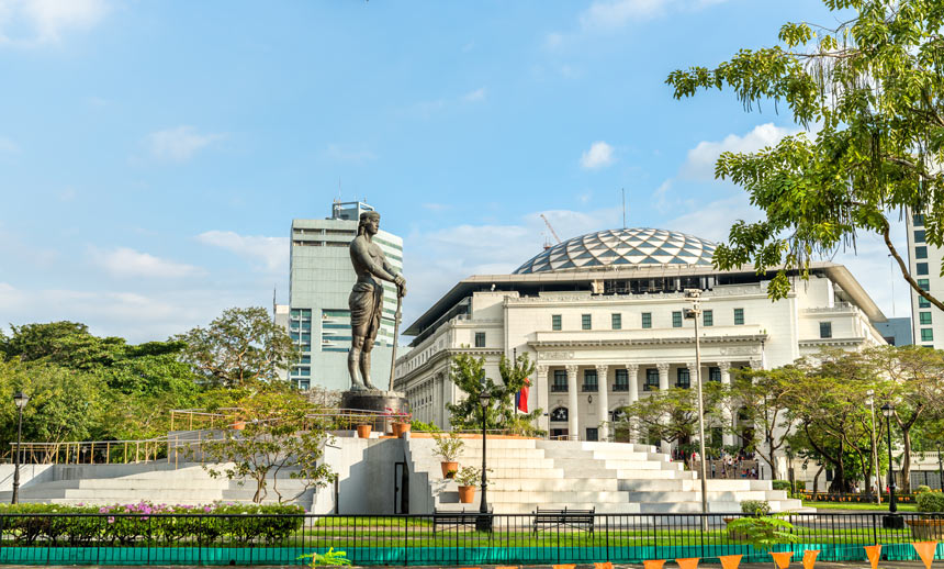 Lapu-Lapu Monument at Rizal Park in Manila with the National Museum of Natural History in the background.
