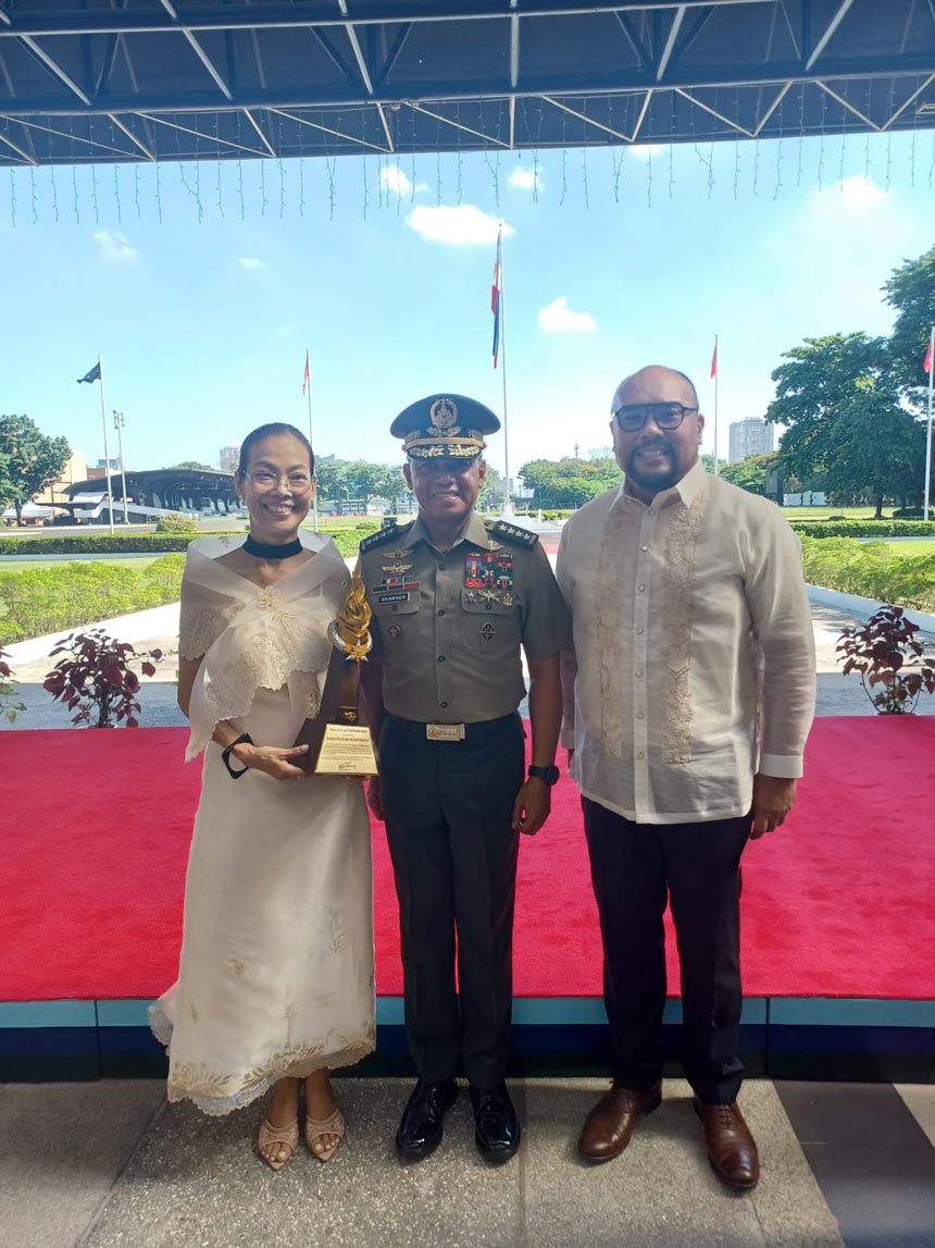 Globe executives receiving the award alongside an AFP representative.