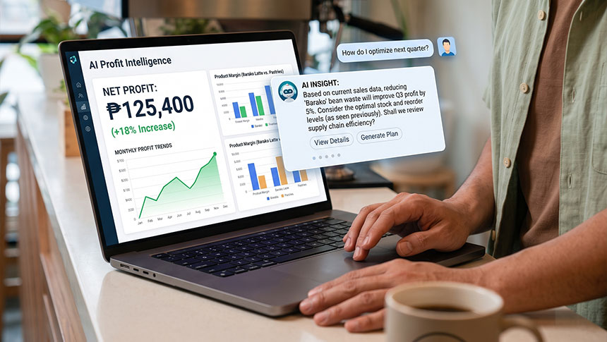Man using a laptop displaying an AI Profit Intelligence dashboard with charts.