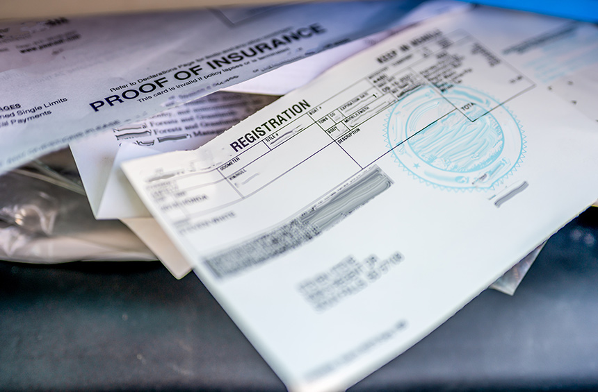 Photo of vehicle registration papers in the glove compartment.
