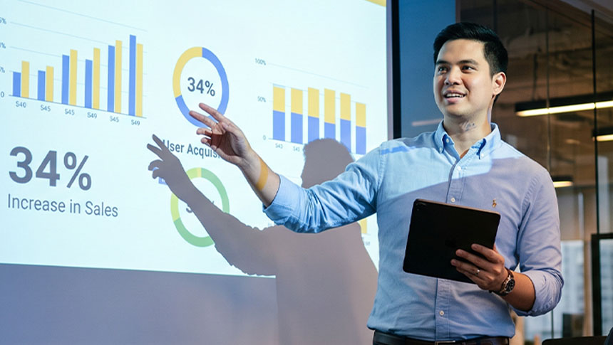 Man presenting business charts with text Business Continuity Matters in the Philippines.
