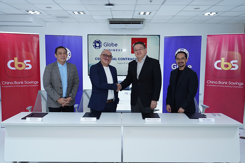 Globe Business and Chinabank Savings executives shake hands to seal their partnership.