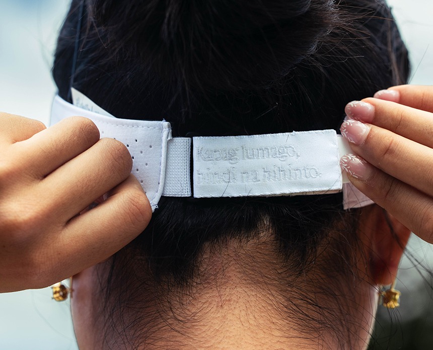 A close-up shot of tennis player Alex Eala's white visor featuring the phrase, âKapag lumago, hindi na hihinto.â